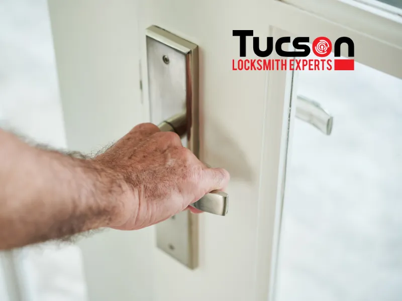 man inspecting lock handle after repair