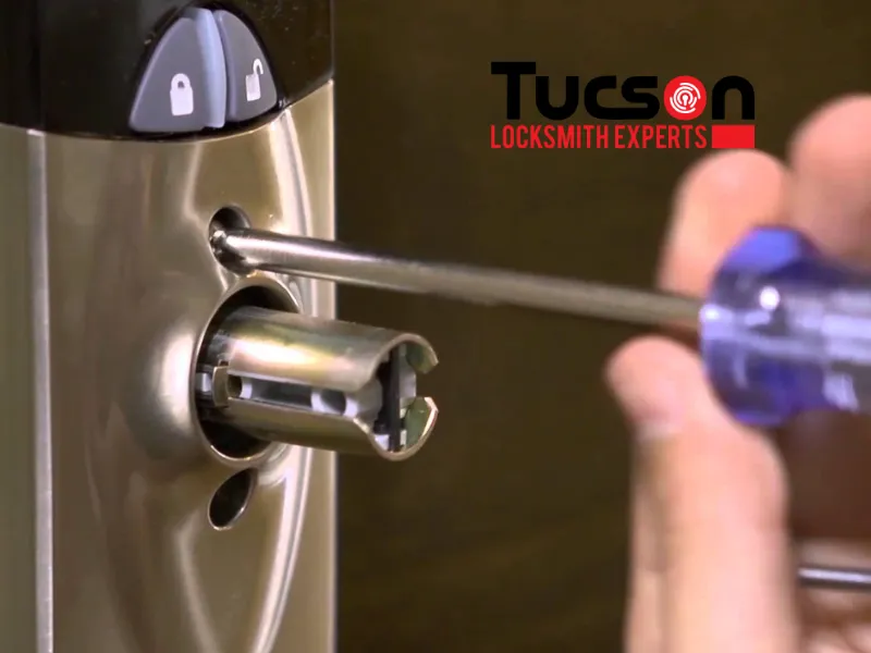 man uninstalling electronic lock to repair handle