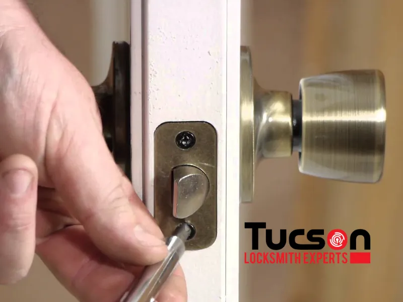 man installing a new deadbolt after repair